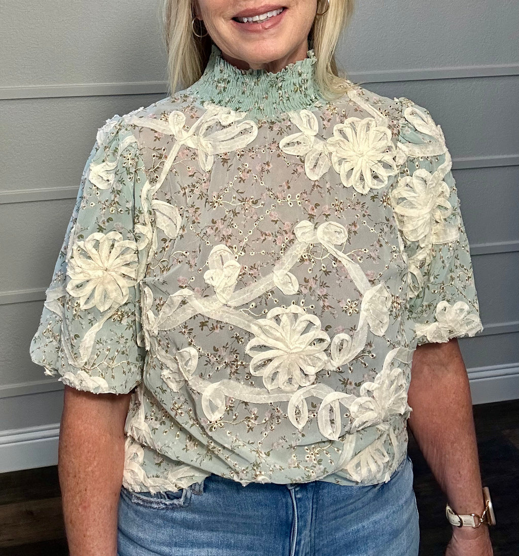 The Garden Party Gossip Mock Neck top